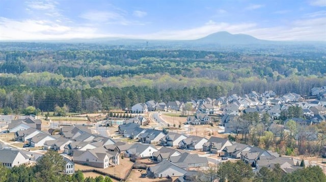 5247 Flannery Chase SW, Powder Springs, GA 30127 - aerial view of property's location with nearby suburban area, a heavily wooded area, and a mountain backdrop