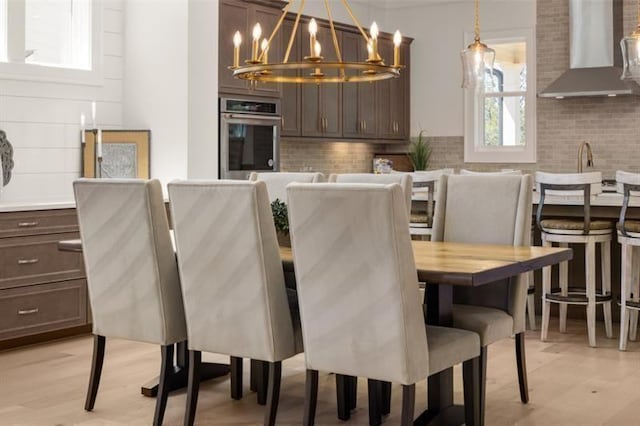 5247 Flannery Chase SW, Powder Springs, GA 30127 - dining room featuring a chandelier and light wood-style floors