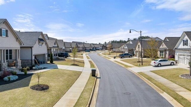 5247 Flannery Chase SW, Powder Springs, GA 30127 - view of asphalt road with a residential view, street lights, sidewalks, and curbs