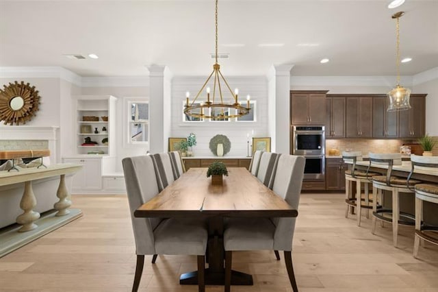 5247 Flannery Chase SW, Powder Springs, GA 30127 - dining space with a chandelier, light wood-style flooring, crown molding, recessed lighting, and built in features