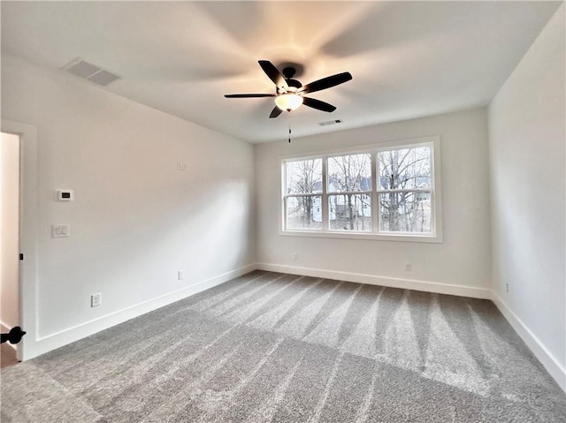 carpeted empty room featuring ceiling fan