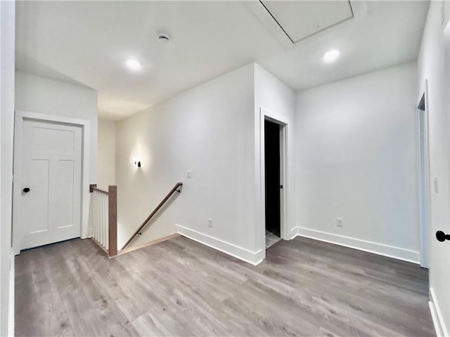 unfurnished room with wood-type flooring