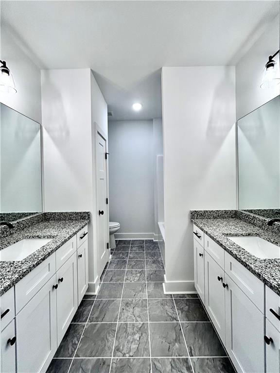 bathroom with vanity and toilet