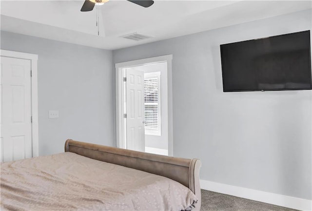 bedroom with ceiling fan, carpet floors, visible vents, and baseboards