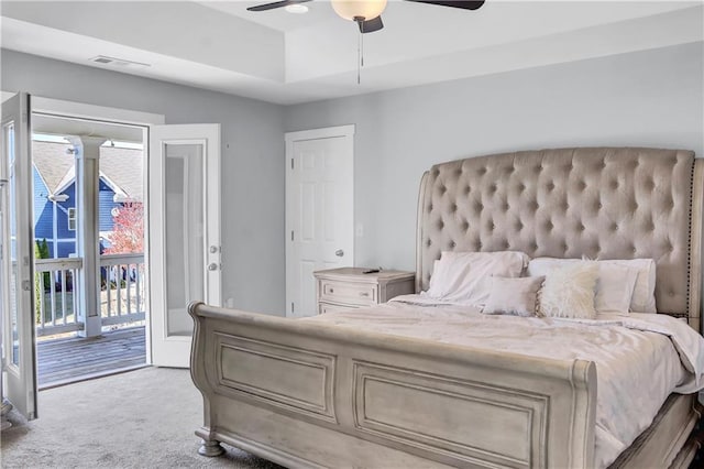 bedroom with carpet floors, access to exterior, ceiling fan, and visible vents