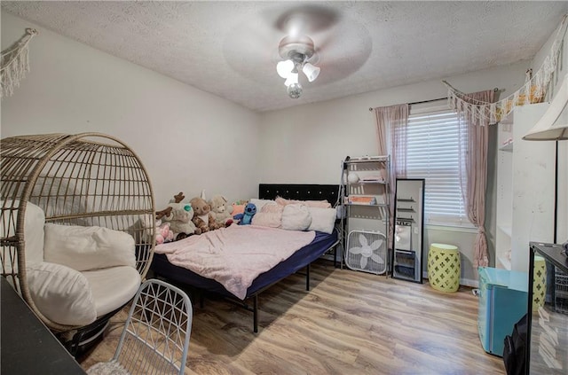 36 Skyview Cir, Cartersville, GA 30120 - bedroom with wood finished floors, a textured ceiling, and a ceiling fan