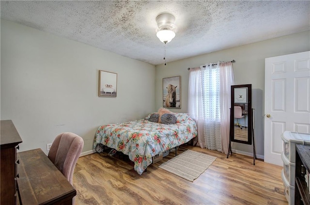 36 Skyview Cir, Cartersville, GA 30120 - bedroom featuring wood finished floors, a textured ceiling, and baseboards