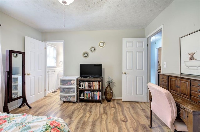 36 Skyview Cir, Cartersville, GA 30120 - bedroom featuring light wood-type flooring, a textured ceiling, baseboards, and ensuite bathroom