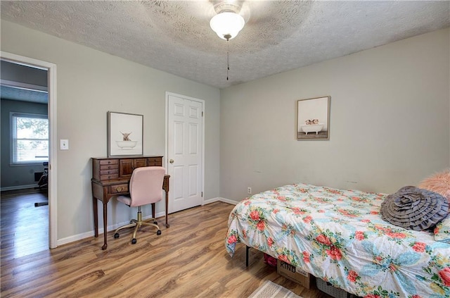 36 Skyview Cir, Cartersville, GA 30120 - bedroom with wood finished floors, baseboards, a textured ceiling, and an office area