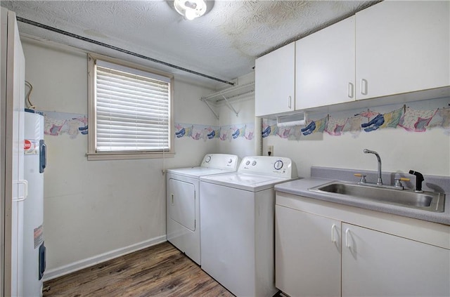 36 Skyview Cir, Cartersville, GA 30120 - laundry room featuring washer and dryer, water heater, cabinet space, wood finished floors, and baseboards