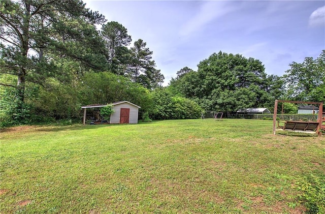 36 Skyview Cir, Cartersville, GA 30120 - view of grassy yard with a storage unit and an outbuilding