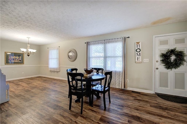 36 Skyview Cir, Cartersville, GA 30120 - dining area featuring a chandelier, dark wood finished floors, healthy amount of natural light, baseboards, and a textured ceiling