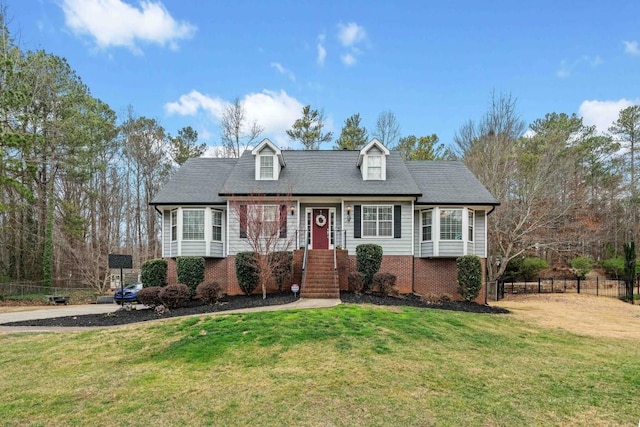 cape cod-style house featuring a front lawn