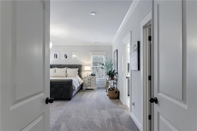 carpeted bedroom featuring ornamental molding