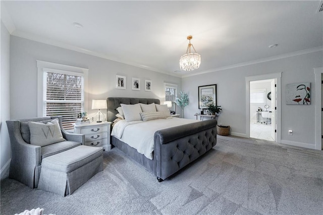 carpeted bedroom featuring connected bathroom, crown molding, multiple windows, and a notable chandelier