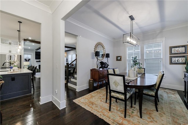 dining room with crown molding and dark hardwood / wood-style flooring