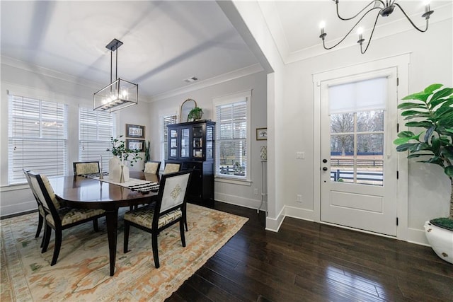 dining area featuring ornamental molding, dark hardwood / wood-style floors, and a healthy amount of sunlight