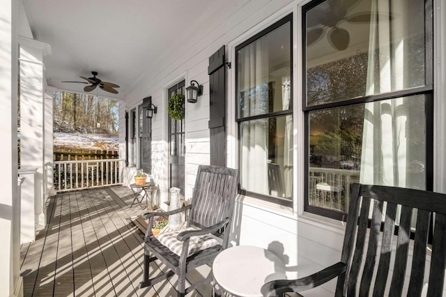 deck featuring a porch and ceiling fan