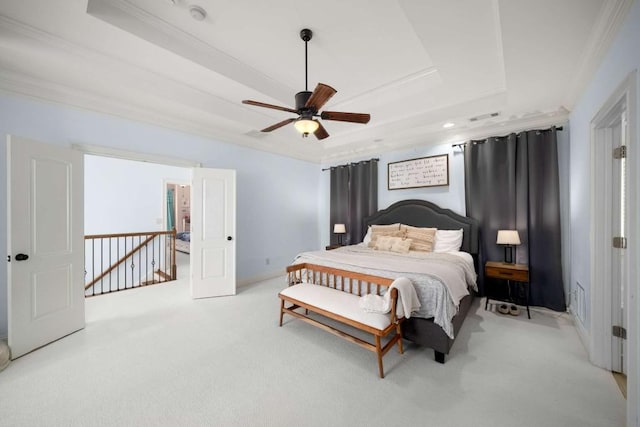 bedroom featuring ceiling fan, light carpet, and a raised ceiling