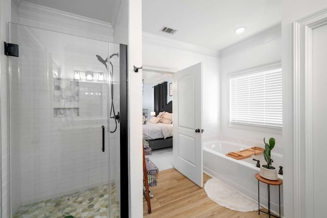 bathroom featuring plus walk in shower, crown molding, and wood-type flooring