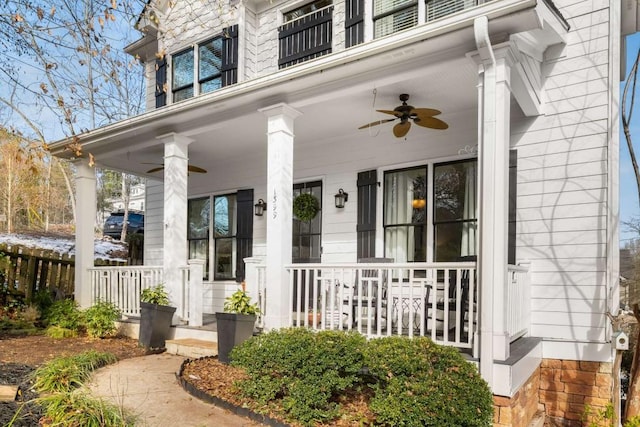 doorway to property featuring ceiling fan and covered porch