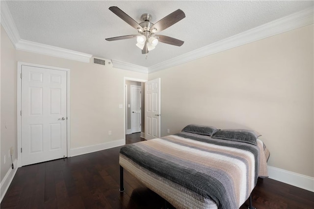 bedroom featuring ceiling fan, dark wood-type flooring, a textured ceiling, and ornamental molding