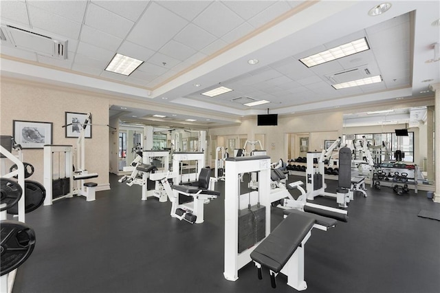 gym with a paneled ceiling