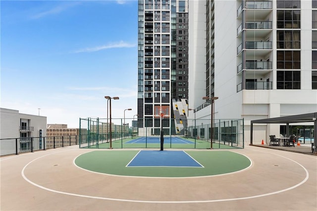 view of basketball court with tennis court