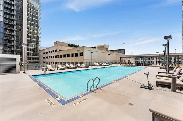 view of swimming pool featuring a patio area