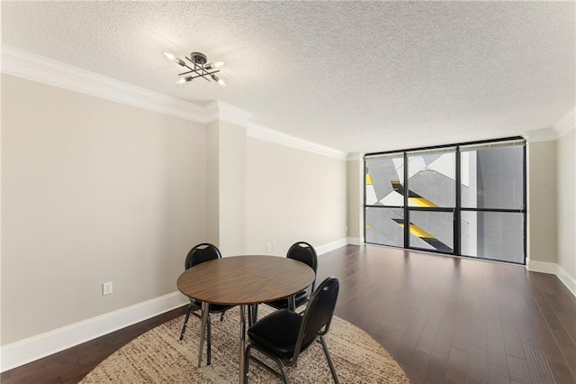 dining room with a textured ceiling, dark hardwood / wood-style floors, expansive windows, and crown molding