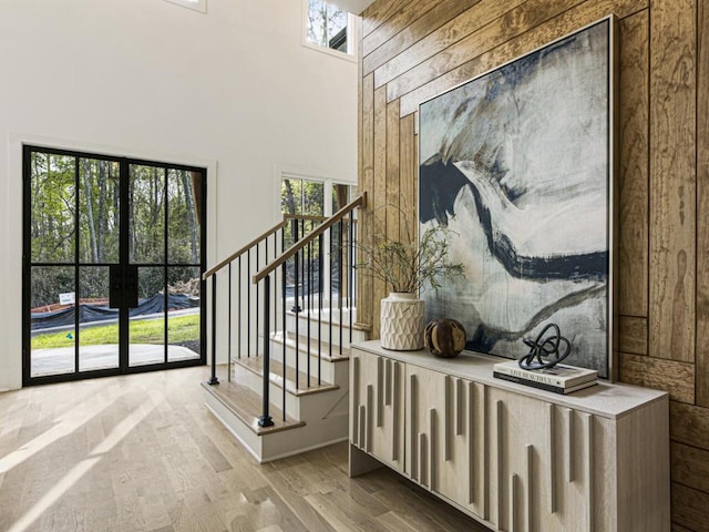 interior space with a high ceiling and hardwood / wood-style floors