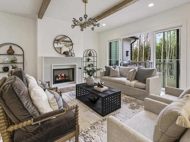 living room with wood-type flooring, a notable chandelier, and beam ceiling