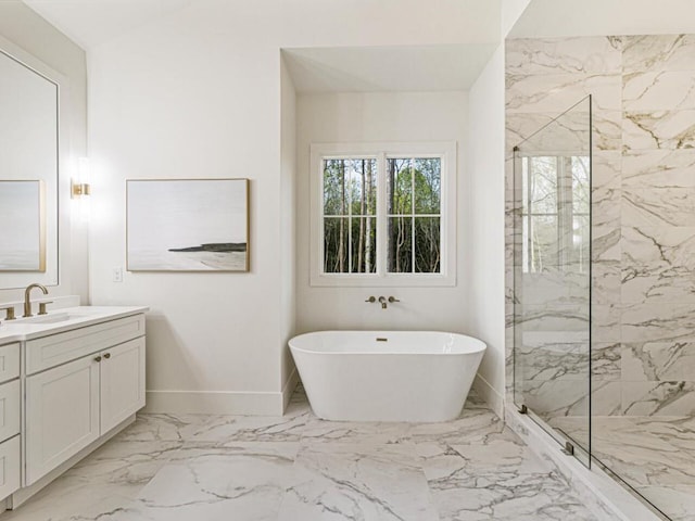 bathroom with vanity and shower with separate bathtub