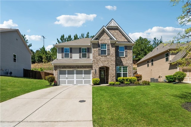 4050 Danbury Farms Dr, Cumming, GA 30040 - craftsman inspired home featuring fence, a front lawn, concrete driveway, an attached garage, and brick siding