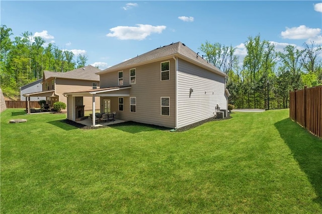 4050 Danbury Farms Dr, Cumming, GA 30040 - back of property with fence, a yard, and a patio