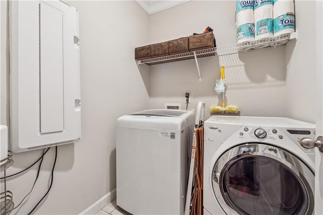 4050 Danbury Farms Dr, Cumming, GA 30040 - washroom featuring baseboards, tile patterned flooring, separate washer and dryer, and laundry area