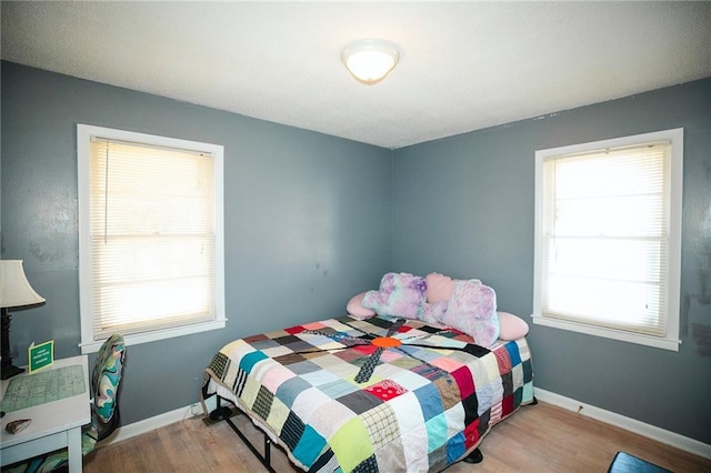 bedroom with light hardwood / wood-style flooring