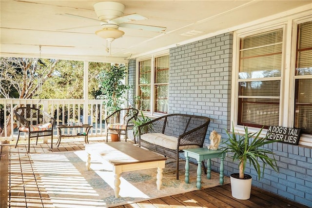 sunroom / solarium with ceiling fan