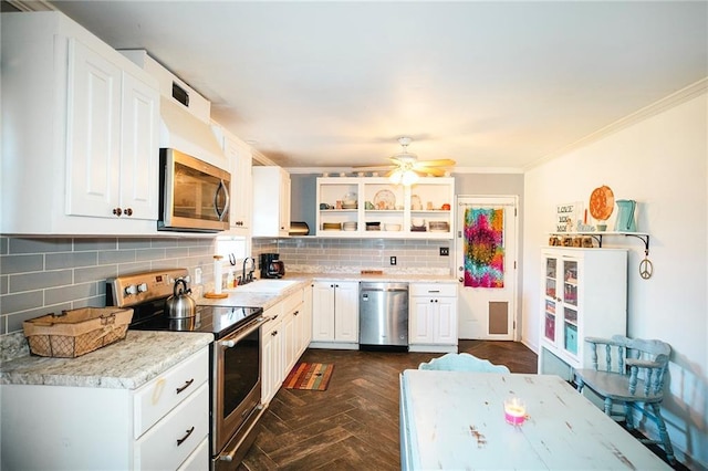 kitchen featuring white cabinetry, dark parquet floors, tasteful backsplash, appliances with stainless steel finishes, and crown molding