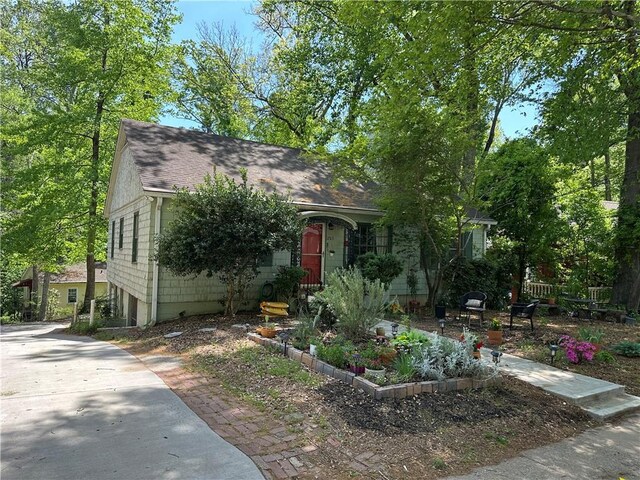 1783 Ridgewood Dr, Atlanta, GA 30307 - view of property hidden behind natural elements featuring roof with shingles