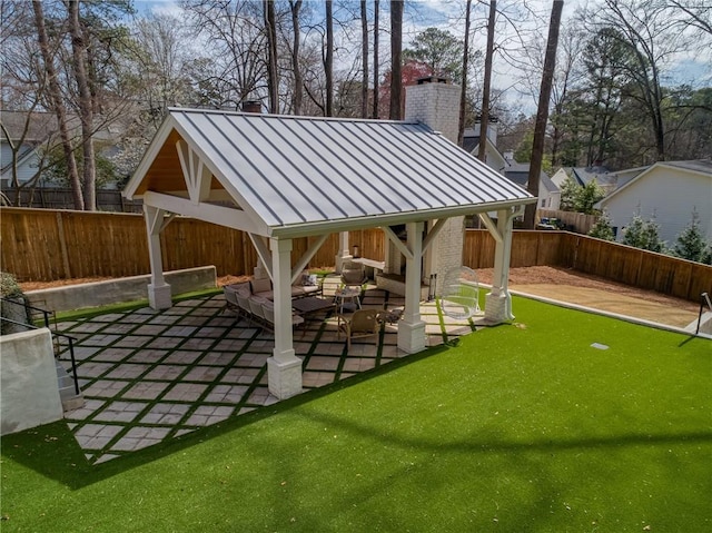 exterior space with a gazebo, a fenced backyard, an outdoor living space, and a patio