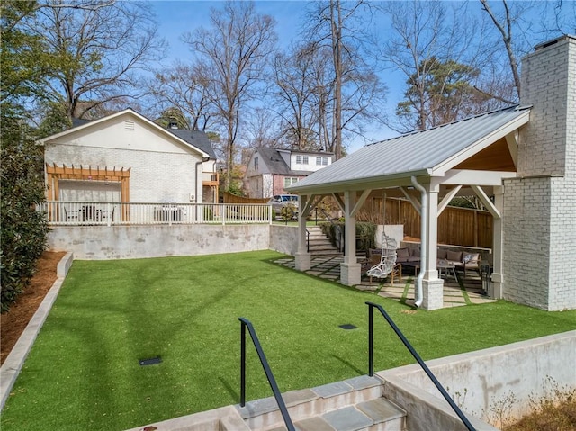 view of yard featuring an outdoor living space, fence, a gazebo, a patio area, and a pergola