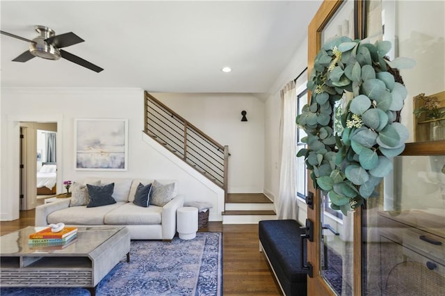 living room with ceiling fan, stairs, ornamental molding, recessed lighting, and wood finished floors