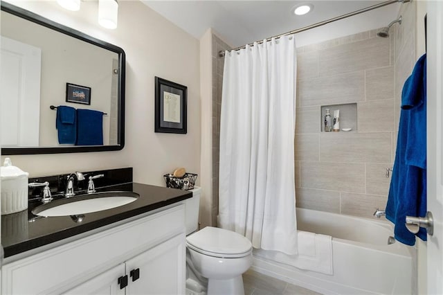 full bathroom featuring shower / bathtub combination with curtain, tile patterned flooring, toilet, and vanity