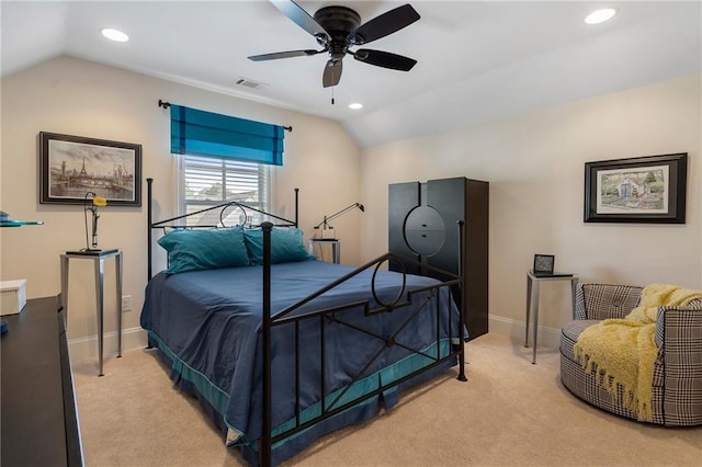 bedroom featuring light colored carpet, lofted ceiling, and ceiling fan