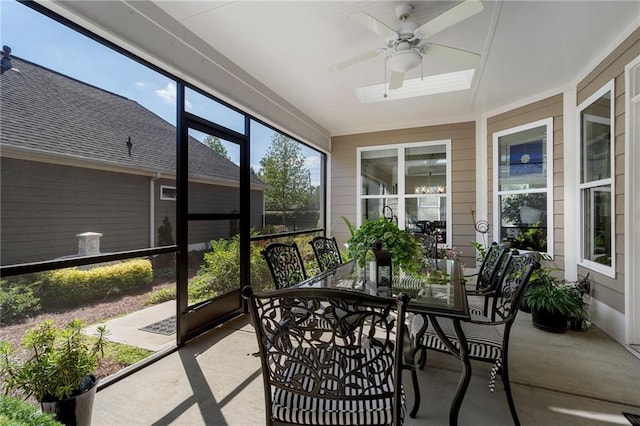 sunroom featuring ceiling fan