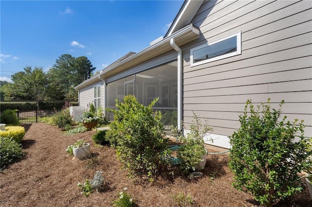 view of side of property with a sunroom