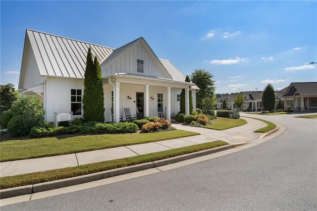 view of front of property featuring a garage and a porch