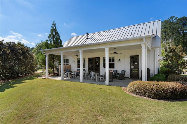 view of front of house featuring a garage, a porch, and a front lawn