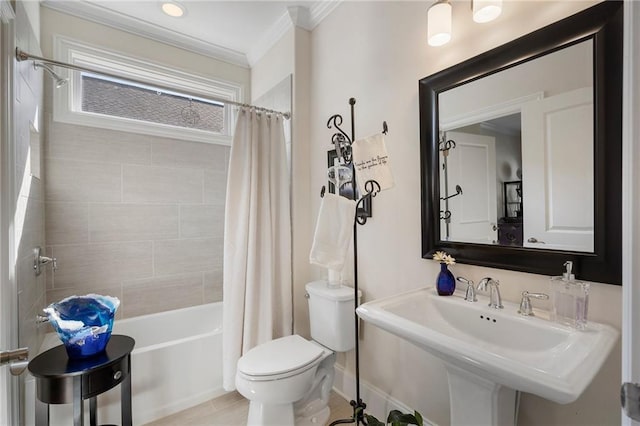 full bathroom featuring tile patterned flooring, crown molding, toilet, sink, and shower / bathtub combination with curtain